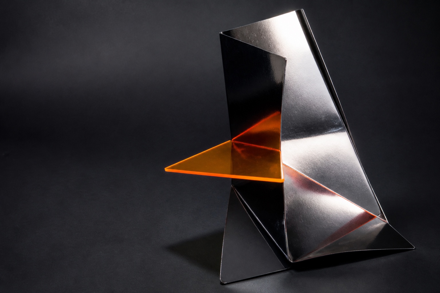 OTHER's angular chrome sculpture crossed by a signal-orange plane.